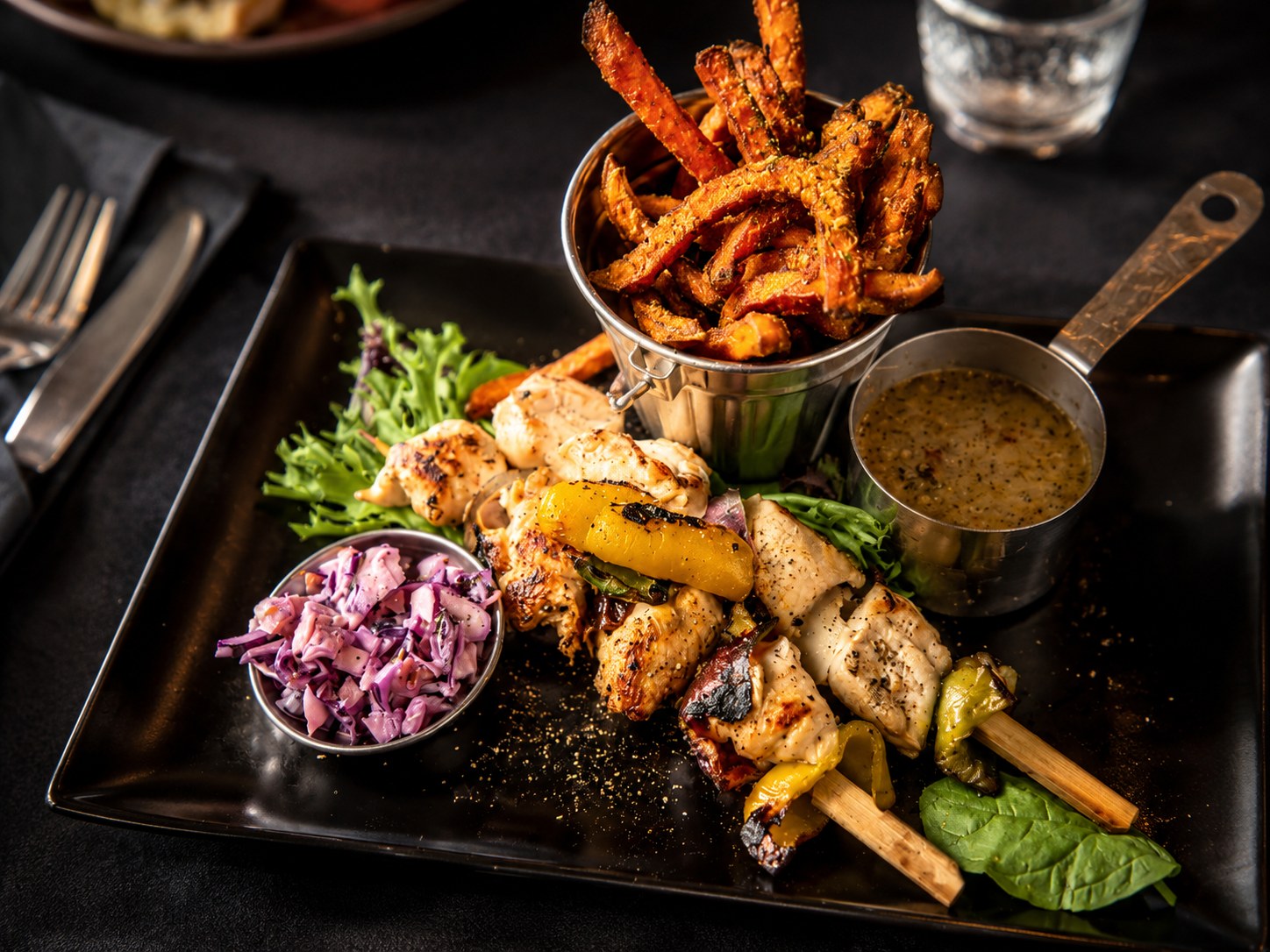 Grilled meat, chips and salad at The Bank Bar and Grill